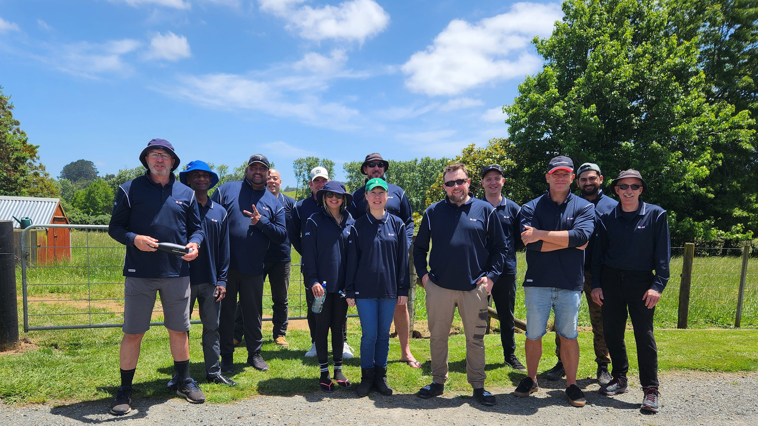 Image Mobils Auckland team spent a day caring for newly planted shrubs and trees at the Papakura stream.