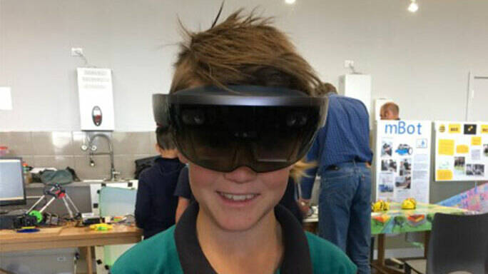 Image Photo  Student Markham Lewis tries out a Hololens at the 2017 Southern Peninsula Network Science Fair.