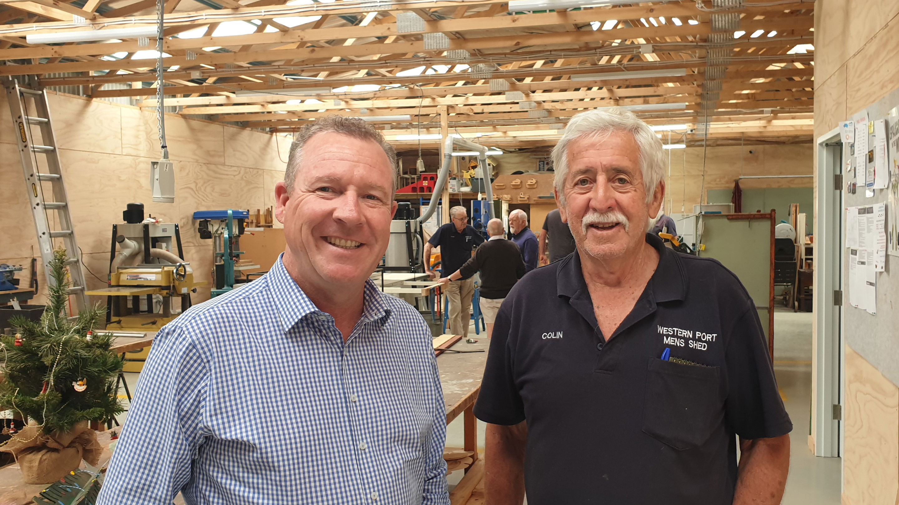 Image Esso Long Island Point Manager, David McCord (left), visited the Western Port Men's Shed before Christmas to view the new solar panels that had just been installed with help from Esso Australia.