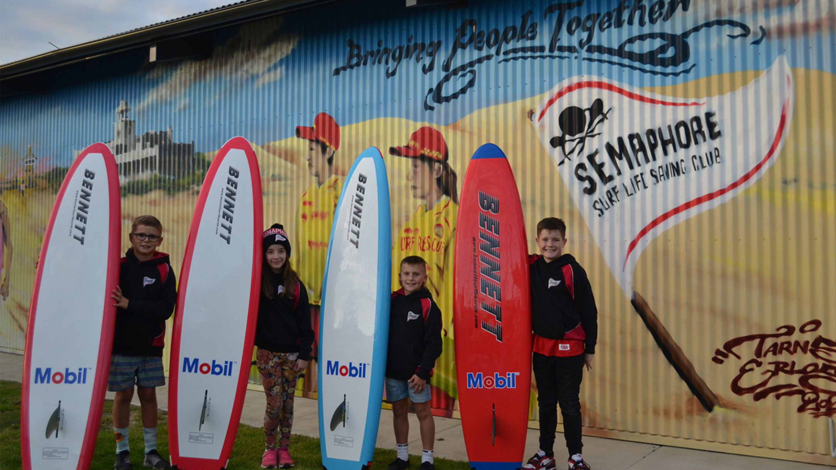 Image Little Nippers club members with their new Mobil sponsored boards.