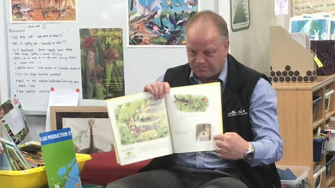 Image Photo  Longford Plants Manager David Anderson reads to students at Maffra Primary School.