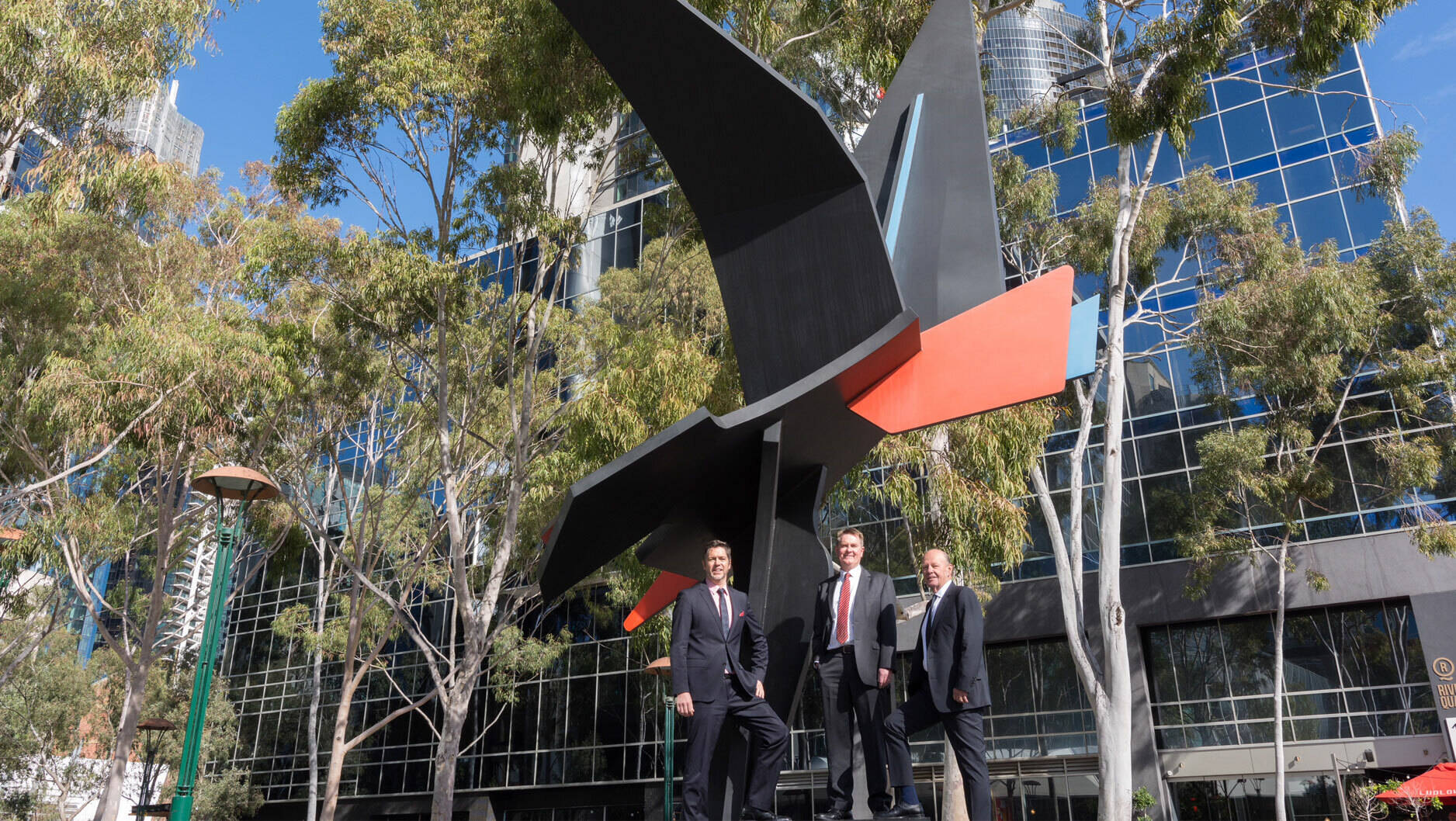 Image Photo  Melbourne City Councillor Nick Reece, ExxonMobil Australia Chairman Richard Owen and Central Equity's Eddie Kutner with the Shearwater scuplture.