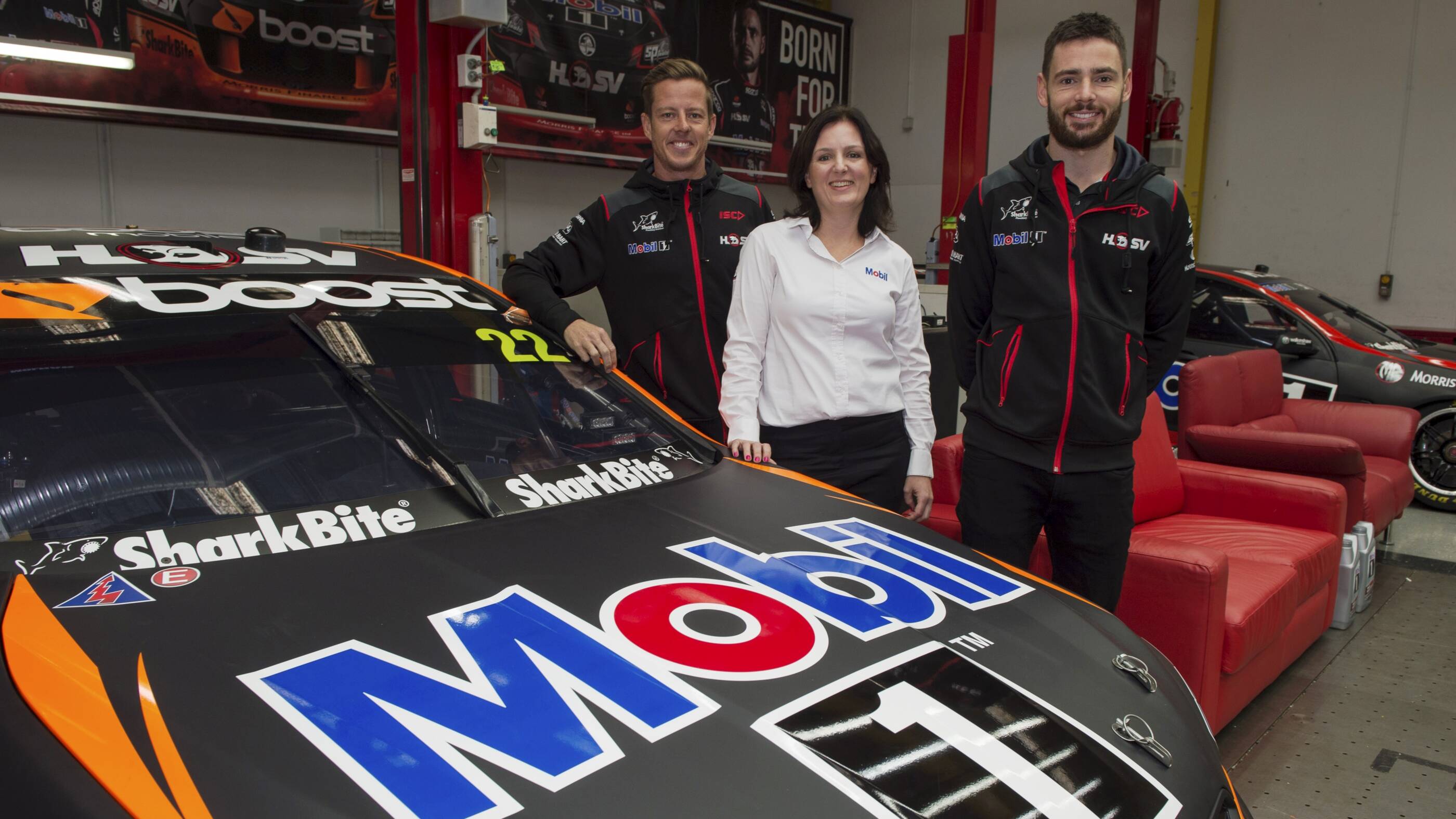 Image Photo Mobil 1 HSV Racing drivers James Courtney (pictured left) and Scott Pye (right) launch the new 'Ask for Mobil' consumer promotion with Mobil 1 Retail Manager Christie Torwick (centre).