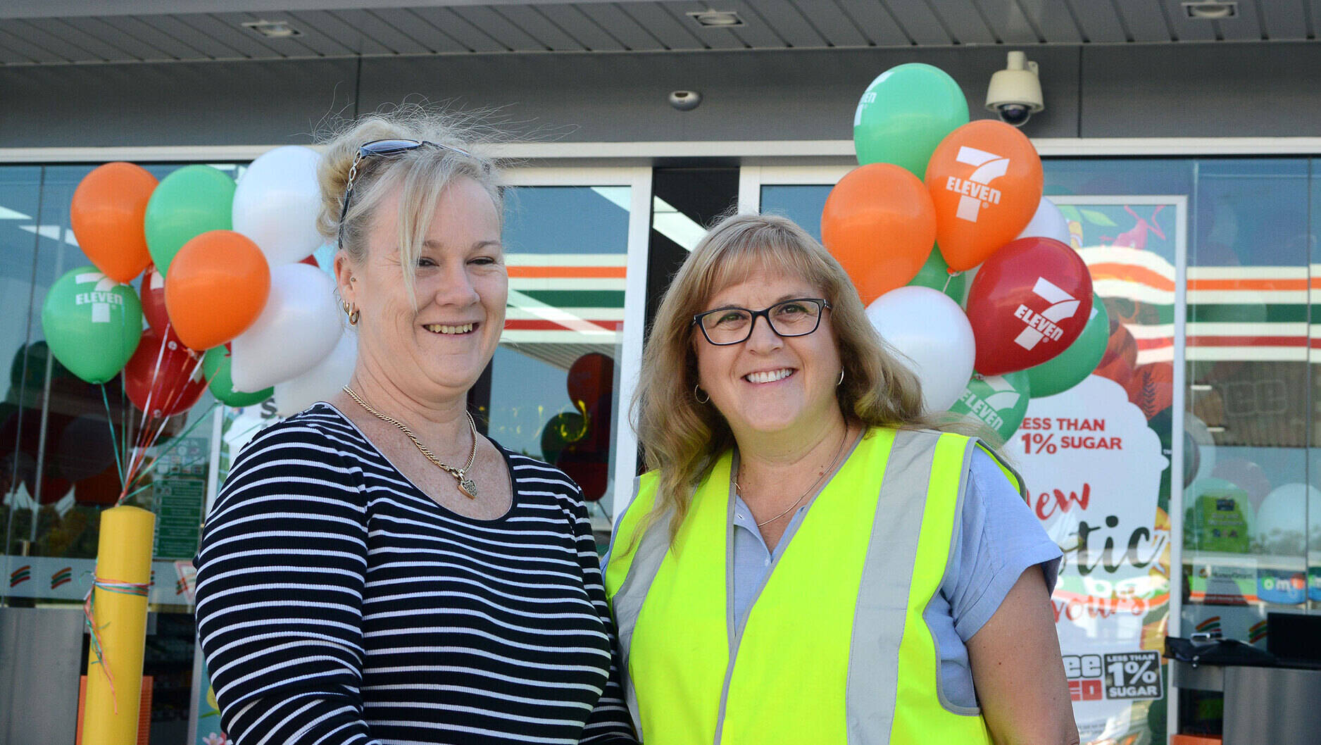 Image Photo— Donna Stewart (right) with a happy customer at the opening of the 500th 7-Eleven Mobil store. “Since we began our strategic alliance with 7-Eleven four years ago we have been going from strength to strength.”