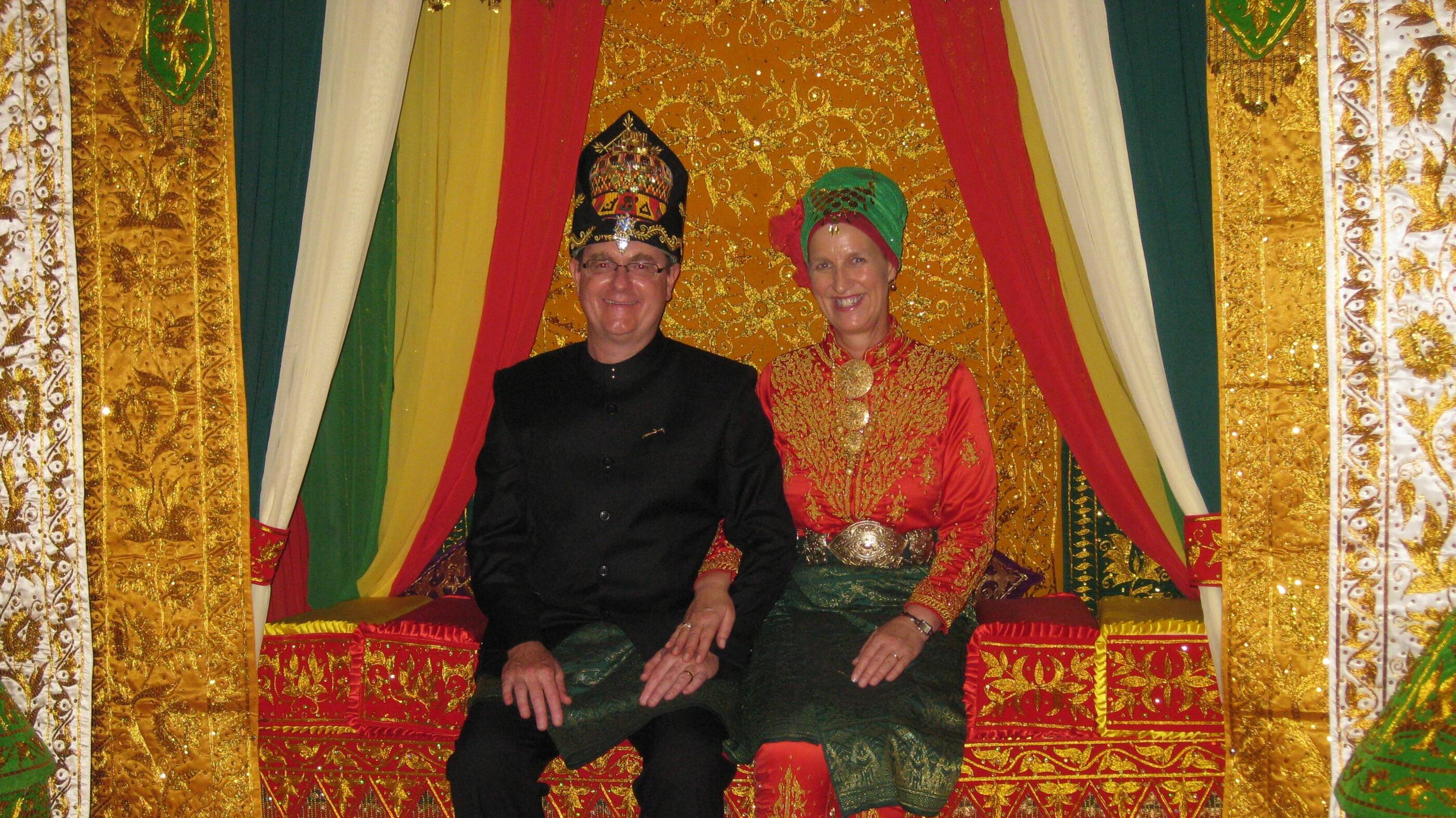 Richard and his wife Jenny, who has been a crucial partner to Richard throughout his career, in traditional dress in Indonesia